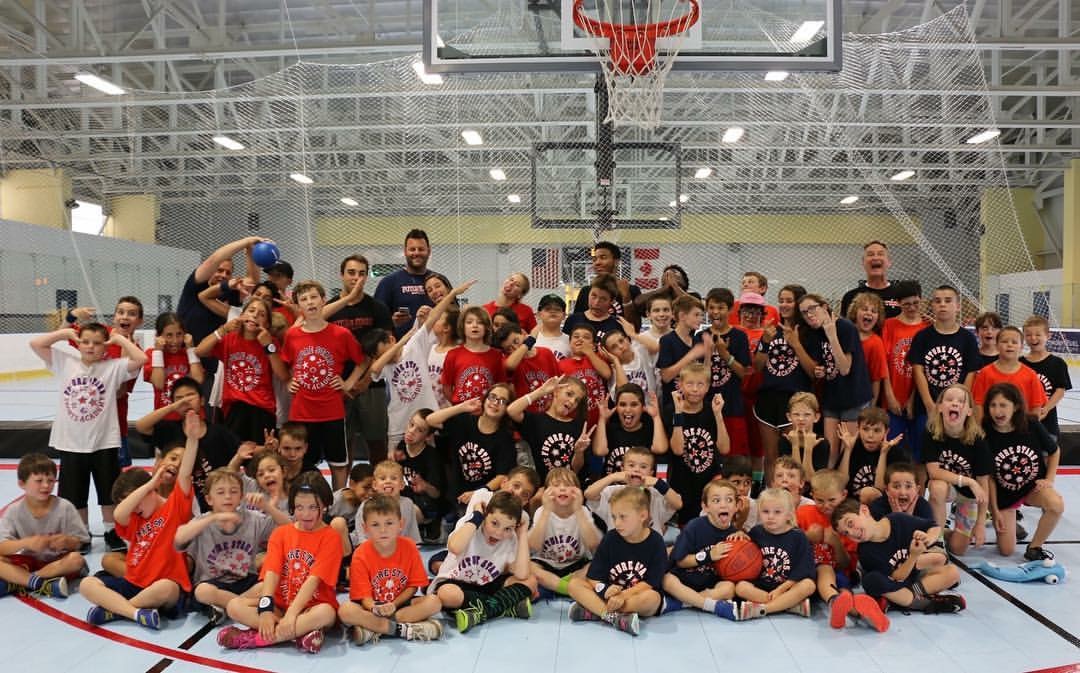 Group photo under basketball hoop