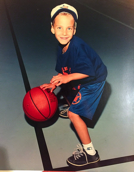 Young player dribbling basketball