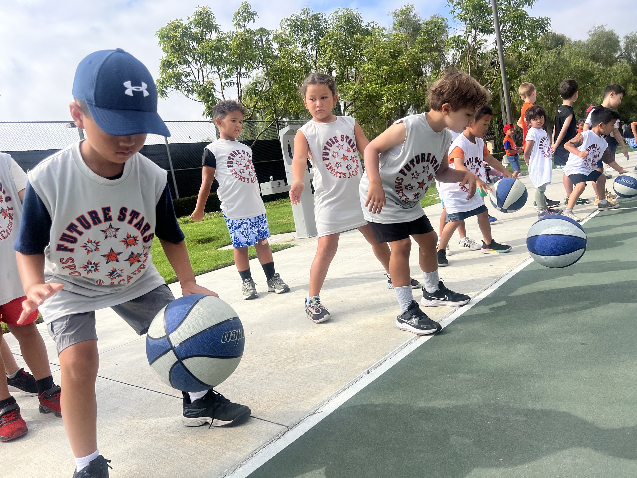 Kids dribbling outdoors
